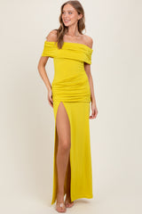 woman wearing a yellow off-shoulder maxi dress with ruching and a thigh-high slit