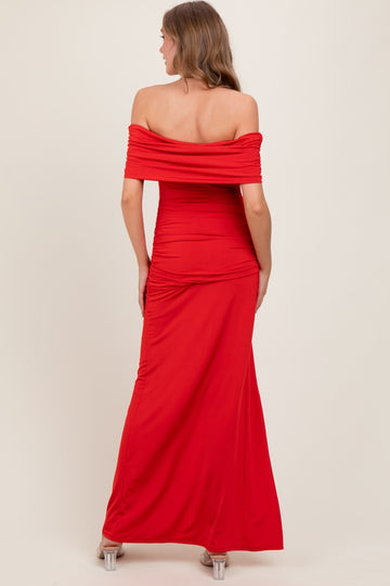 woman wearing a red off-the-shoulder maxi dress with ruching detail on the back