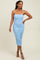 woman wearing a light blue ruched bodycon dress with spaghetti straps and a fitted silhouette