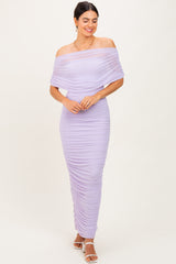 woman wearing a lavender off-shoulder ruched maxi dress with a fitted silhouette and stylish neckline