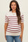woman wearing a cream and burgundy striped maternity top with short sleeves and a fitted style