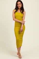 woman wearing a yellow form-fitting midi dress with texture and a scoop neck