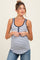 woman wearing a striped maternity tank top with a button detail and a visible baby bump