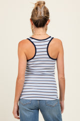 woman wearing a light blue and navy striped maternity tank top with racerback style and casual jeans