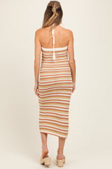 maternity wear knit midi dress with horizontal stripes in peach and cream, model showing the back view