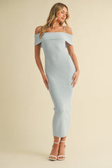 woman wearing a light blue off-the-shoulder ribbed midi dress and strappy heels