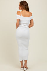 woman wearing a white off-the-shoulder ribbed midi dress with thin straps and a form-fitting silhouette