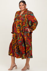 woman wearing a plus-size long sleeve bohemian print dress with a tiered skirt and pockets