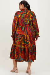 woman wearing a colorful floral plus size maxi dress with long sleeves and ruffled tiers, viewed from the back