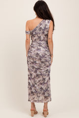 woman wearing a one-shoulder purple and gray tie-dye maternity dress with a fitted silhouette