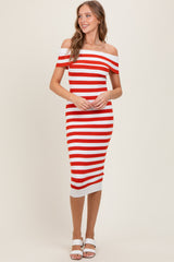 woman wearing a red and white striped off-the-shoulder midi dress with a fitted silhouette and white heels