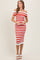 woman wearing a red and white striped off-the-shoulder midi dress with a fitted silhouette and white heels