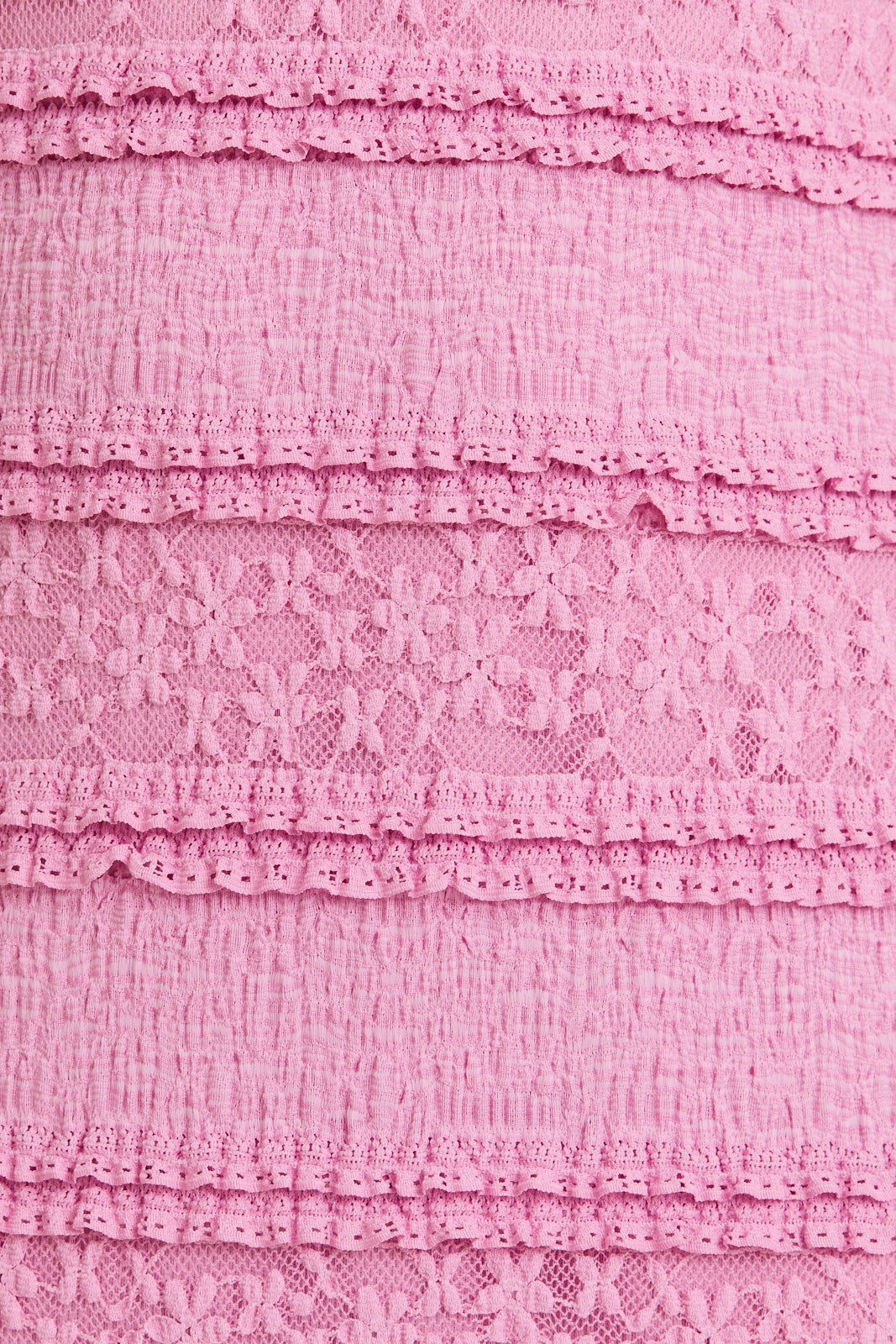 pink textured fabric with layered lace detailing