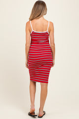 woman wearing a red and white striped maternity dress with a fitted silhouette and spaghetti straps