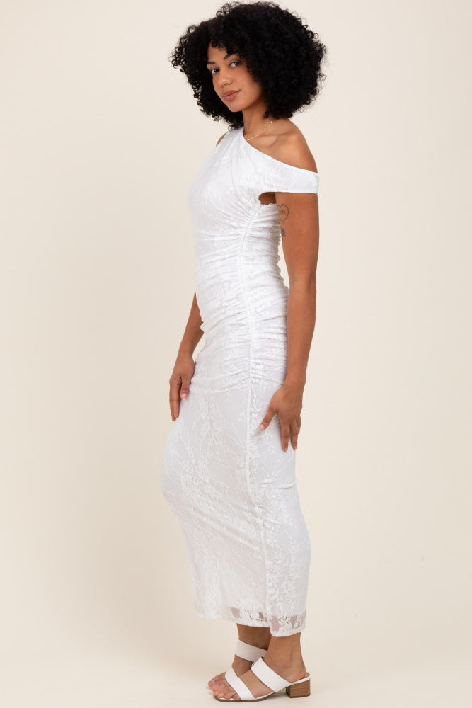 woman wearing a white off-the-shoulder fitted lace dress with ruching and a floor-length hem