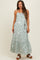 woman wearing a light green floral maternity maxi dress with adjustable straps and a tiered skirt