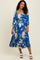 woman wearing a blue floral midi dress with puff sleeves and a square neckline