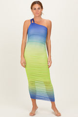 woman wearing a one-shoulder ombre maxi dress in blue and green hues with ruching details