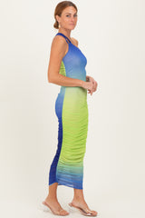 woman wearing a blue and green ombre ruched midi dress with a one-shoulder strap