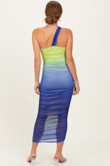 woman wearing a one-shoulder gradient maxi dress in green and blue with ruching details