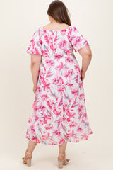 woman wearing a floral maxi dress with short sleeves, showcasing a maternity plus style and relaxed fit from the back