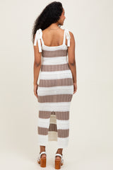 woman wearing a striped knitted maternity dress with tie straps and a slit at the back