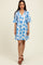 woman wearing a blue and white floral short sleeve collared dress with a fitted bodice and flared skirt
