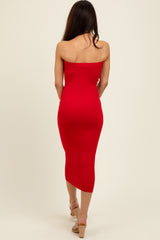 woman wearing a red strapless midi dress, shown from the back, hugging the body silhouette