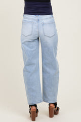 woman wearing light wash maternity wide-leg jeans, view from the back, styled with chunky heels