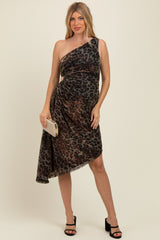 woman wearing a brown and black leopard print one-shoulder maternity dress with ruching, holding a clutch and wearing heels