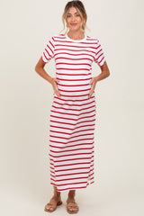 woman wearing a red and white striped maternity maxi dress and holding her baby bump