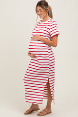 woman wearing a red and white striped maternity maxi dress, showing her baby bump with a side slit detail