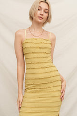 woman wearing a fitted yellow ribbed slip dress with spaghetti straps and textured stripes