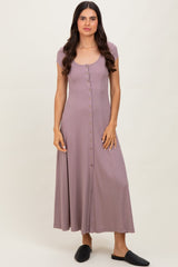 woman wearing a mauve button-up maxi dress with a scoop neckline and short sleeves