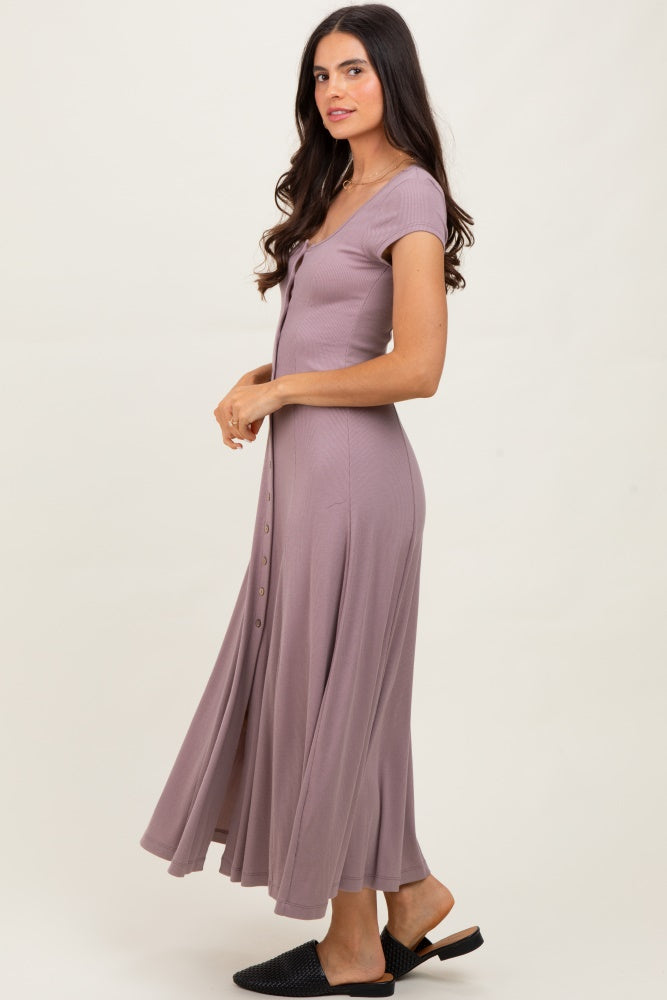 woman wearing a lavender button-up maxi dress with a fitted bodice and flowing skirt