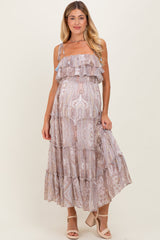 woman wearing a light purple paisley patterned maternity maxi dress with ruffles and adjustable straps, showing baby bump
