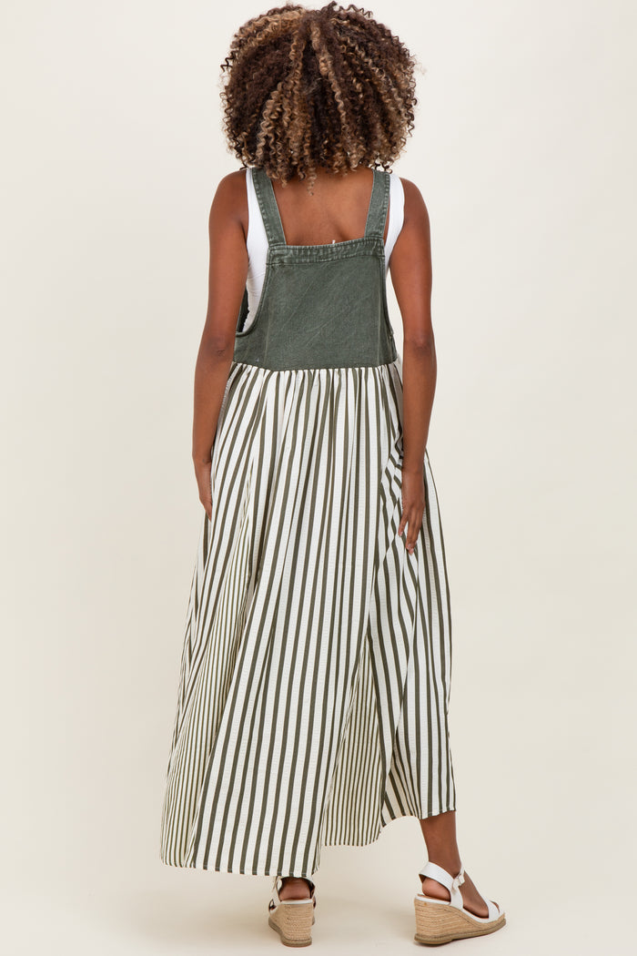 woman wearing a green and white striped maternity dress with a denim top and flowing skirt