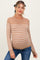 woman wearing a tan striped maternity sweater with a round neckline and long sleeves, showcasing her baby bump