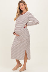 woman wearing a striped long sleeve maternity dress with side slits and a visible baby bump