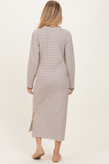 woman wearing a striped long sleeve maternity dress with side slits, showing the back view