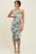 woman wearing a one-shoulder fitted midi dress with a colorful animal print and side ruching
