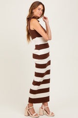 woman wearing a brown and white striped ribbed maxi dress with shoulder ruffles and block heels