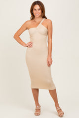 woman wearing a beige ribbed midi dress with a one-shoulder design and form-fitting silhouette