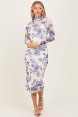 woman wearing a sheer long sleeve floral print dress with a high neckline and fitted silhouette