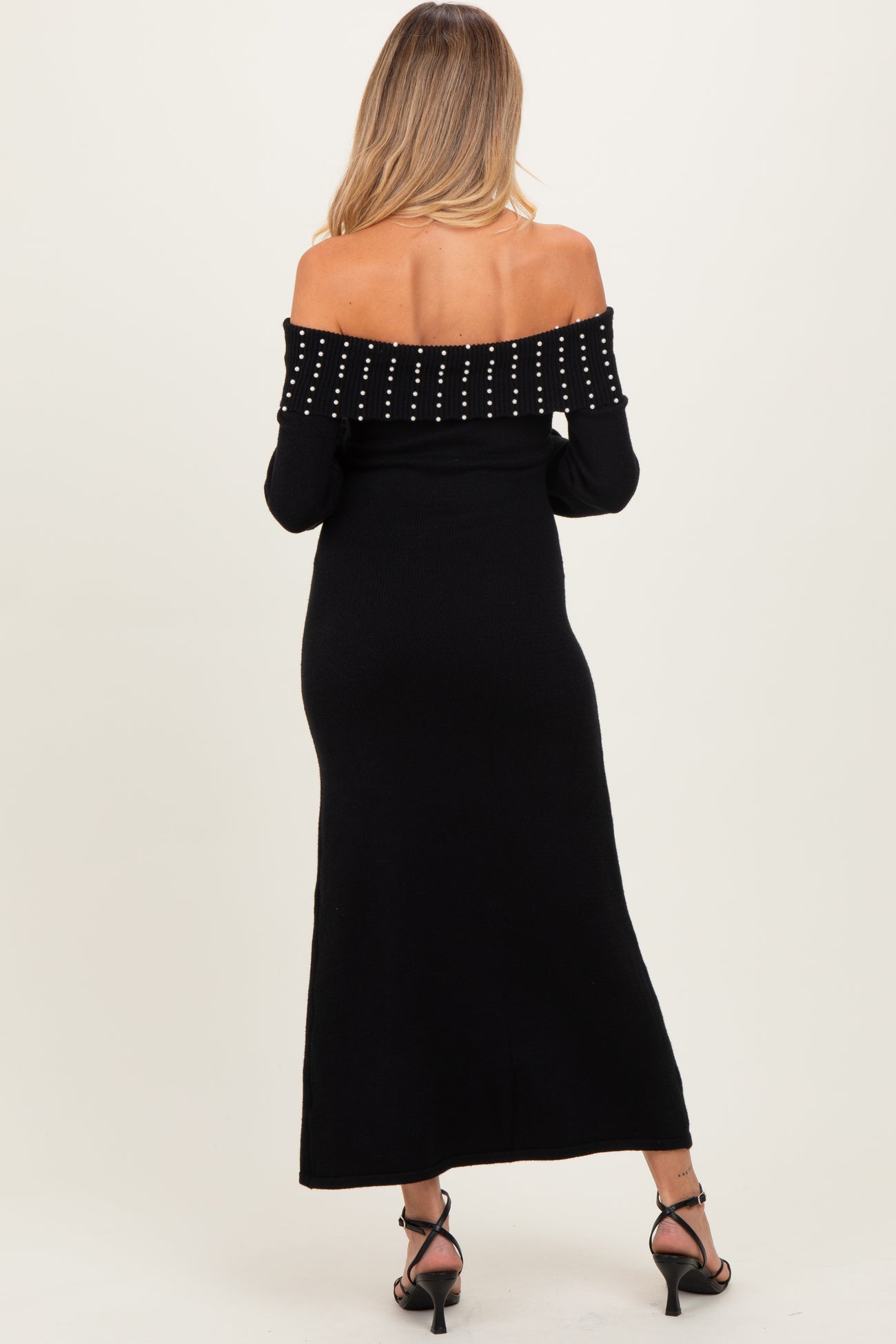 maternity wear black off-the-shoulder maxi dress with embellished neckline, model seen from the back