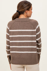 woman wearing a brown and cream striped maternity sweater, shown from the back with a relaxed fit