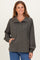 woman wearing a dark gray long sleeve pullover with a button-down collar and front pockets