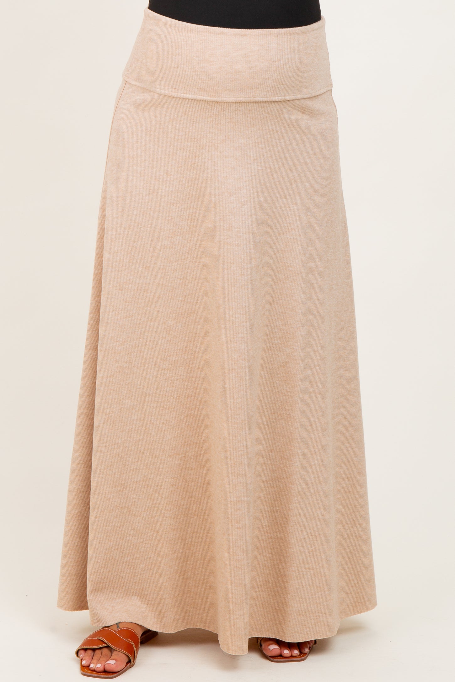 maternity wear beige maxi skirt with a wide waistband, worn by a model, flowy and comfortable fit