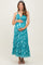 woman wearing a turquoise floral maternity maxi dress and holding her baby bump