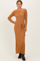 woman wearing a ribbed brown long sleeve maxi dress with a tie waist detail